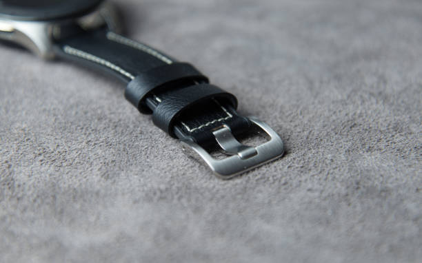 istock Watch on a grey leather background with clasp closed from the top 1150019808