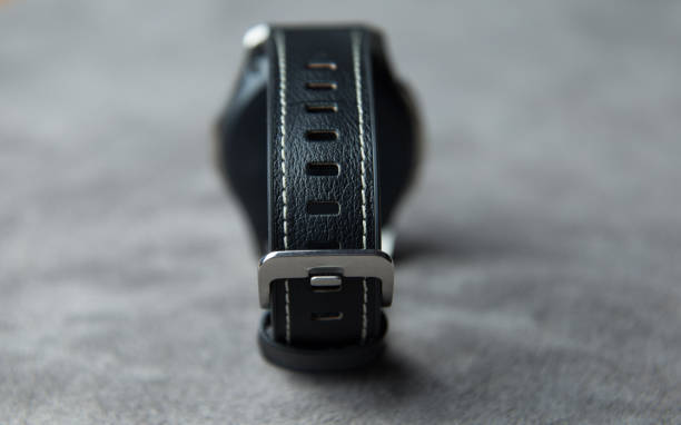 istock Watch on a grey leather background with clasp closed from the back 1150019810
