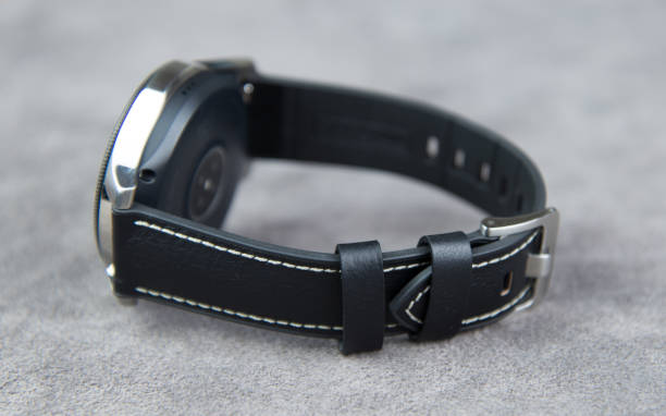 istock Watch on a grey leather background with clasp closed 1150019817