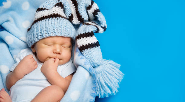 istock Sleeping  Newborn Baby, New Born Kid Boy Sleeping In Woolen Hat 1150019824