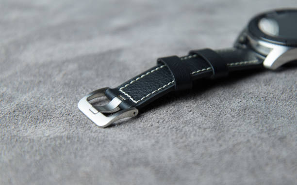 istock Watch flat on a grey leather background with clasp closed from the top 1150019833