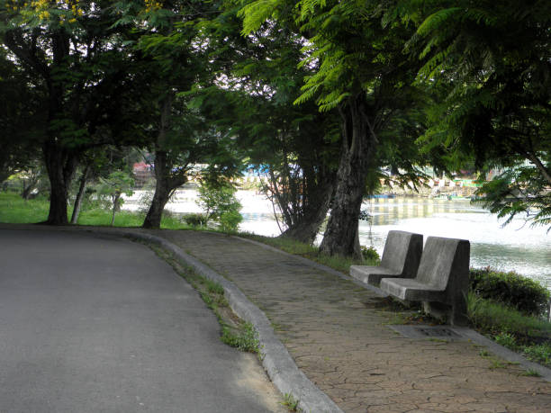 istock Stone bench next to the park 1150019838