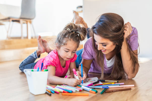 istock Mother and daughter drawing 1150021075