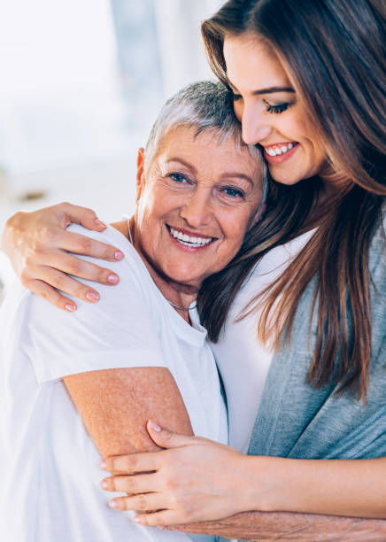 istock Woman hugging mother with love 1150021078