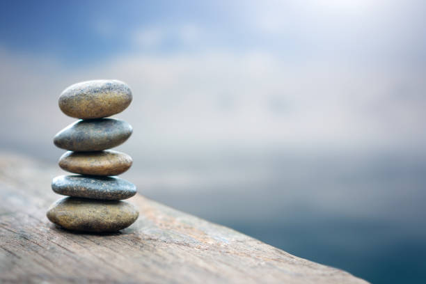 istock Balance stone with spa on river coast 1150021196