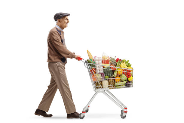 istock Senior man pushing a shopping cart 1150024982