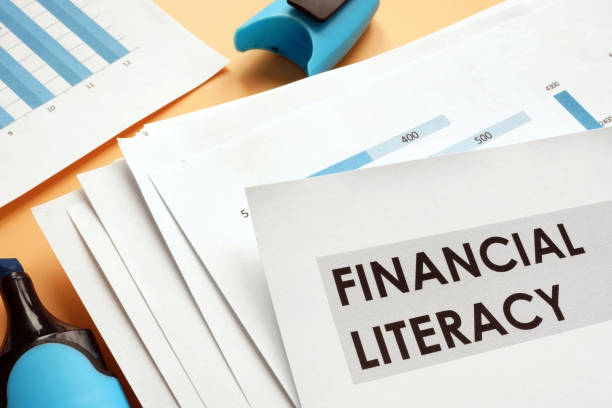 Papers about financial literacy with business graphs. Papers about financial literacy with business graphs. financial literacy stock pictures, royalty-free photos & images