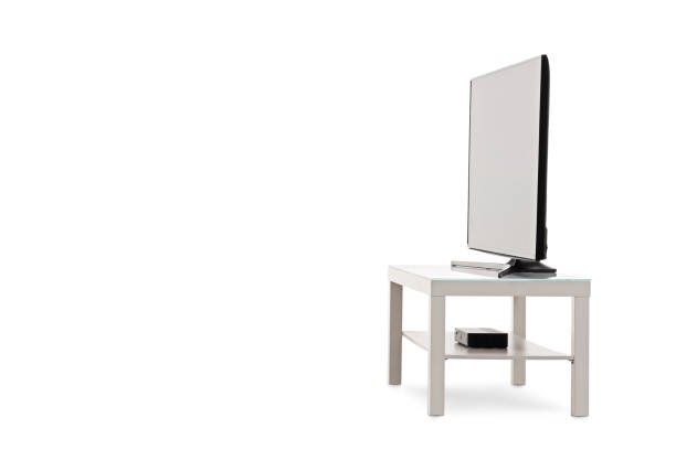 istock Side view shot of a flat screen TV on a white shelf 1150028972