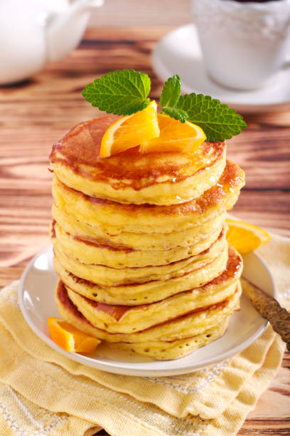 istock Pile of pancakes with honey on plate 1150039236
