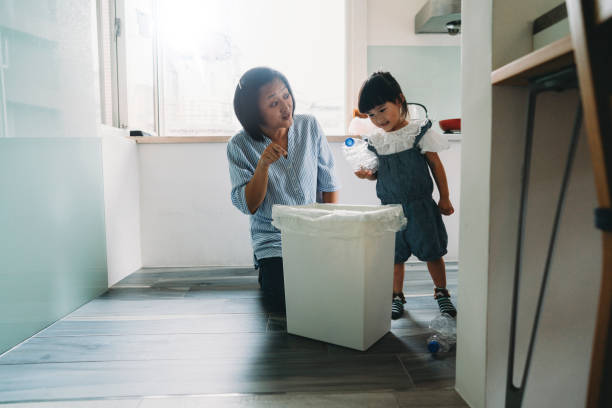 istock Mother teaching her daughter how to recycle waste 1150041919