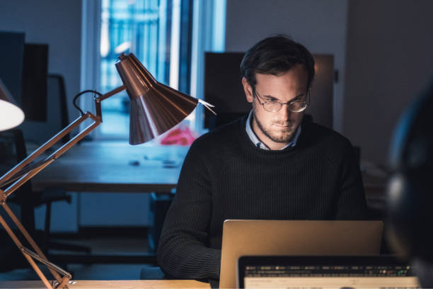 istock young businessman in the office at night 1150042385