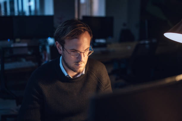 istock young businessman in the office at night 1150042454