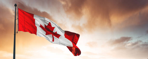 Canada Flag On Sunset Sky Stock Photo - Download Image Now - Canadian Flag,  Canada Day, Canada - iStock