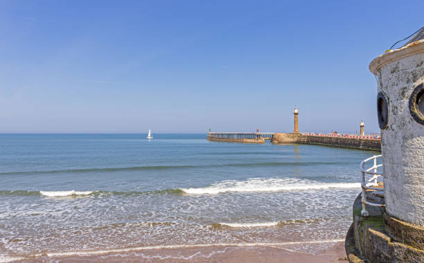 istock Whitby beach with roundhouse and pier. 1150046894