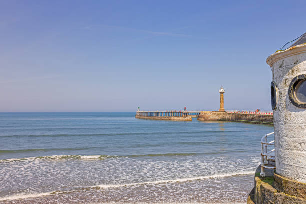 istock Whitby beach with roundhouse and pier. 1150046971