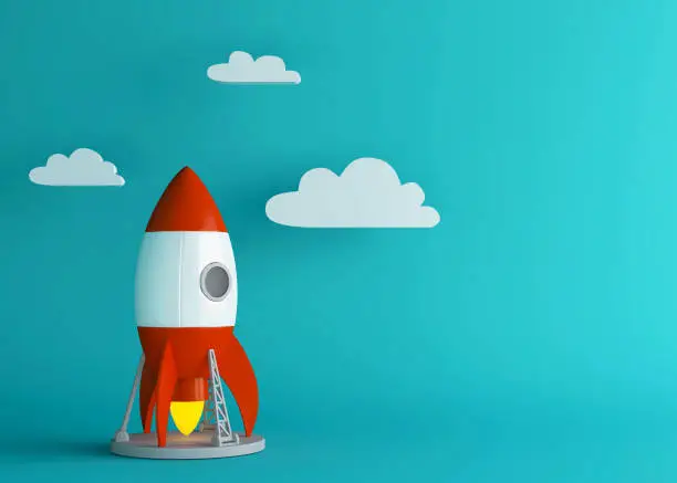 Photo of Business setup or project take off concept. Cartoon rocket launches into bright sky.  Minimal style. 3d render.