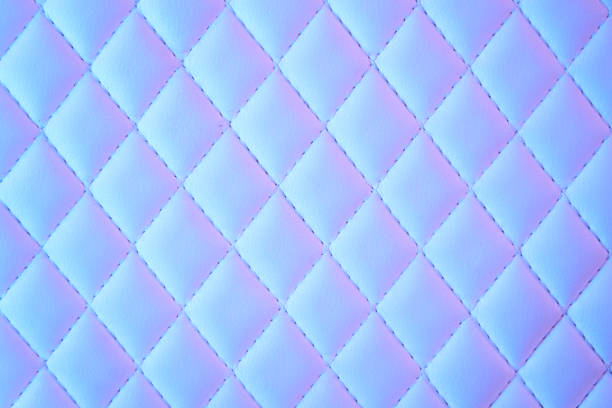 istock Geometric diamond pattern quilted PU leather in neon light 1150047173