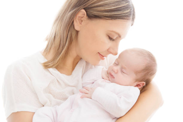 Newborn Baby and Mother, Mom with Sleeping New Born Kid on hands Newborn Baby and Mother, Mom with Sleeping New Born Kid on hands, Two Weeks Old Child on White babyhood photos stock pictures, royalty-free photos & images