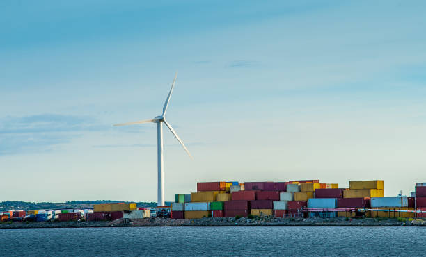 Wind turbine and colorful containers at a harbour