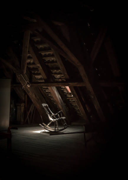 istock Lonely wooden rocking chair on a loft. 1150051227