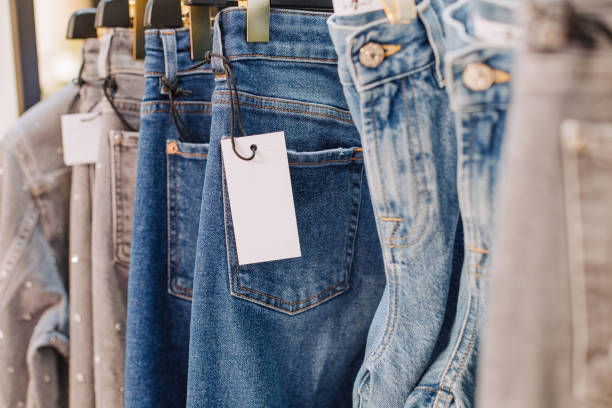 sale assortment denim collection stand boutique shop sale assortment denim collection on the stand in a stylish boutique shop selection sleeve photos stock pictures, royalty-free photos & images