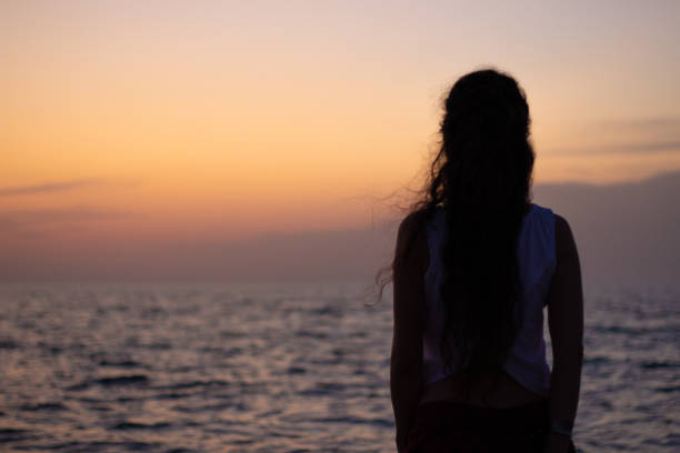 istock Alone girl at the sea 1150052595