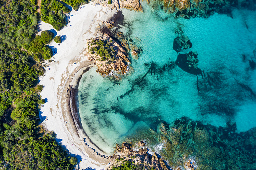 View from above, stunning aerial view of the Prince Beach (Spiaggia del Principe) bathed by a beautiful turquoise sea. Costa Smeralda (Emerald Coast) Sardinia, Italy.