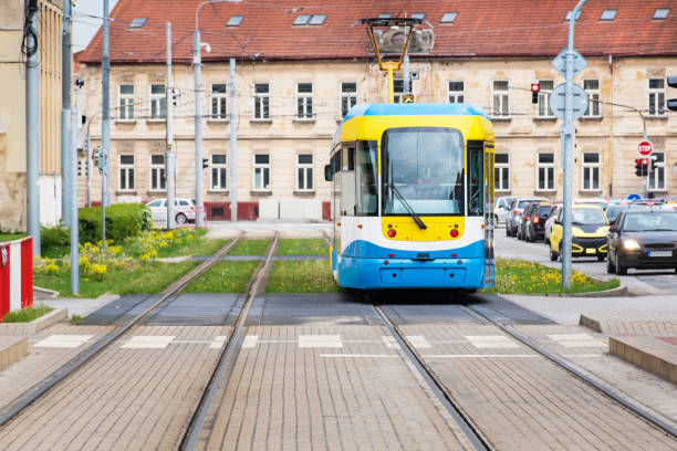 istock Colourful tram runs on tramway track over green grass area in Kosice (SLOVAKIA) 1150054463