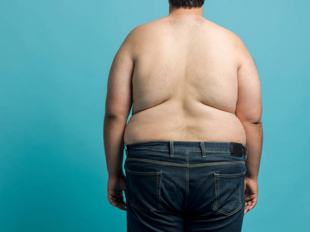 избыточный вес молодой человек - pot belly стоковые фото и изображения