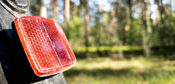 istock Rear light reflector on a red bicycle in the close up 1150057435