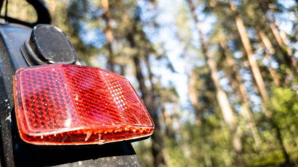 Rear light reflector on a red bicycle in the close up