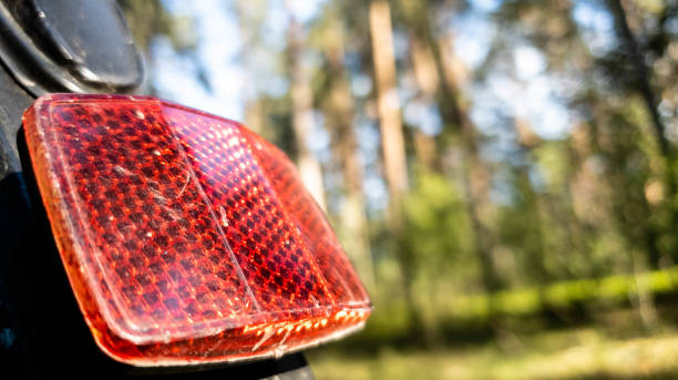 istock Rear light reflector on a red bicycle in the close up 1150057458