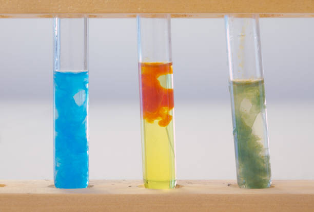 Three test tubes containing (left to right) precipitate of copper hydroxide, precipitate of iron (III) hydroxide and precipitate of iron (II) hydroxide. The precipitates were made by adding a solution of sodium hydroxide to tubes containing Cu2+, Fe3+ and Fe2+ ions in solution, respectively. This testing for ions practical features in GCSE Chemistry exams.