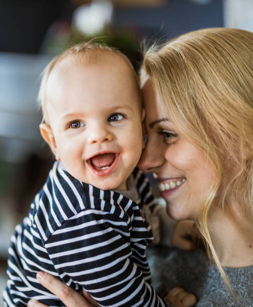 istock Affectionate mother and her cute baby boy at home. 1150061753