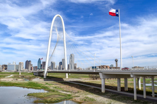 istock Texas State Flag Waving in the Wind on Bridge Above Trinity River - Dallas, Texas 1150062091