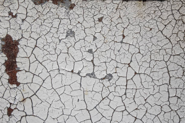istock Background texture of gray peeling paint over rusted metal, crackled pattern 1150062786