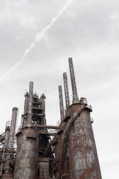 istock Large blast furnaces and smokestacks from a steel industry complex 1150062842