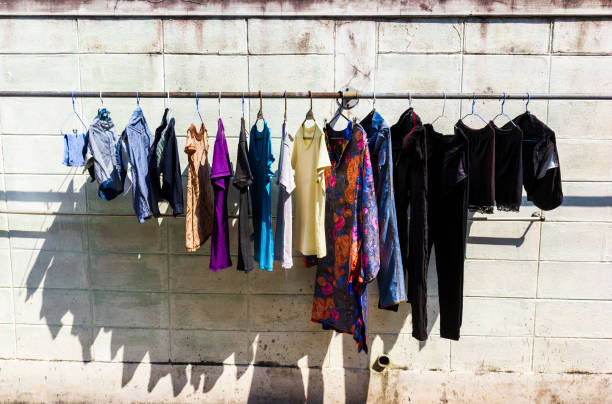istock Clothes hang against wall to dry 1150063003