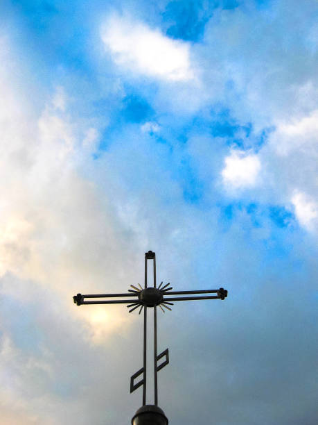 istock Orthodox cross on the background of cloudy sky 1150063147