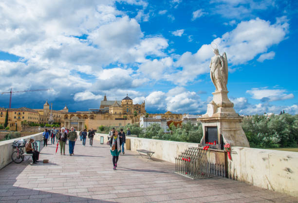 Cordoba, Spain - May 10, 2016: San Rafael statue on historical Roman bridge in a beautiful sunny day