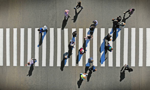 Aerial. Pedestrian crosswalk crossing, top view. Aerial. Pedestrian crosswalk crossing, top view. commuter photos stock pictures, royalty-free photos & images