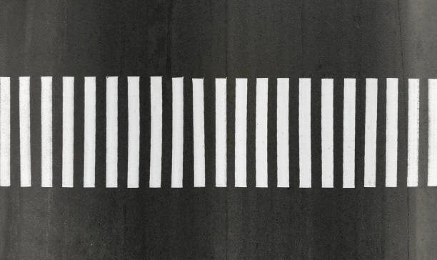 istock Pedestrian crosswalk zebra with no people, aerial, top view 1150072475