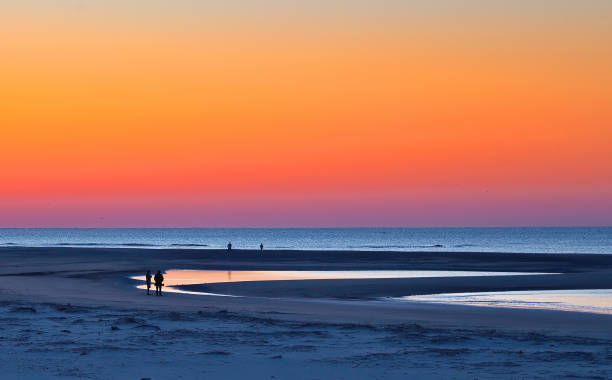 istock Blue Hour Beach Under Orange Sunrise 1150072527