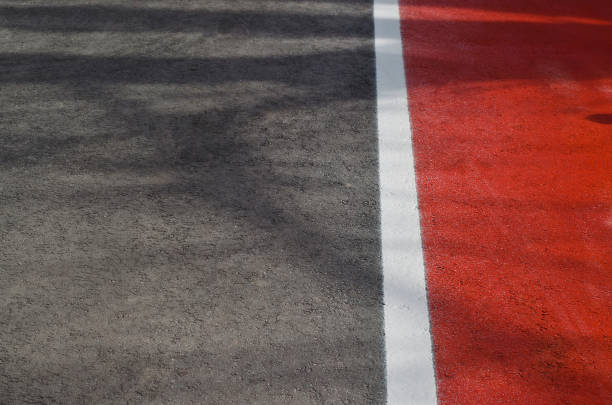 istock Making road surface markings on a driveway in the summer 1150077246