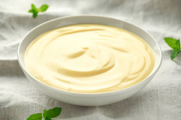 istock Bowl of vanilla custard on rustic background 1150078105