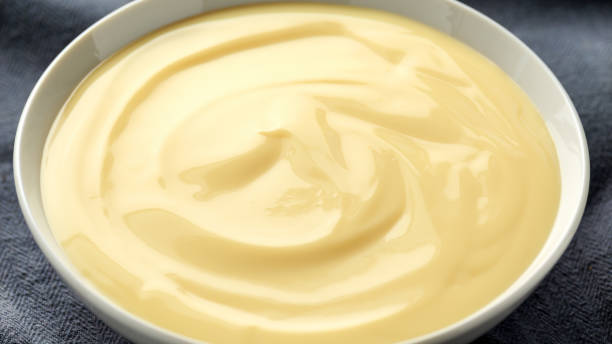 istock Bowl of vanilla custard on rustic background 1150078118
