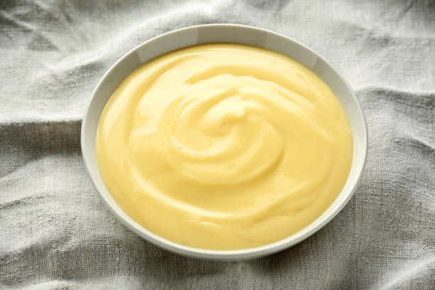 istock Bowl of vanilla custard on rustic background 1150078137