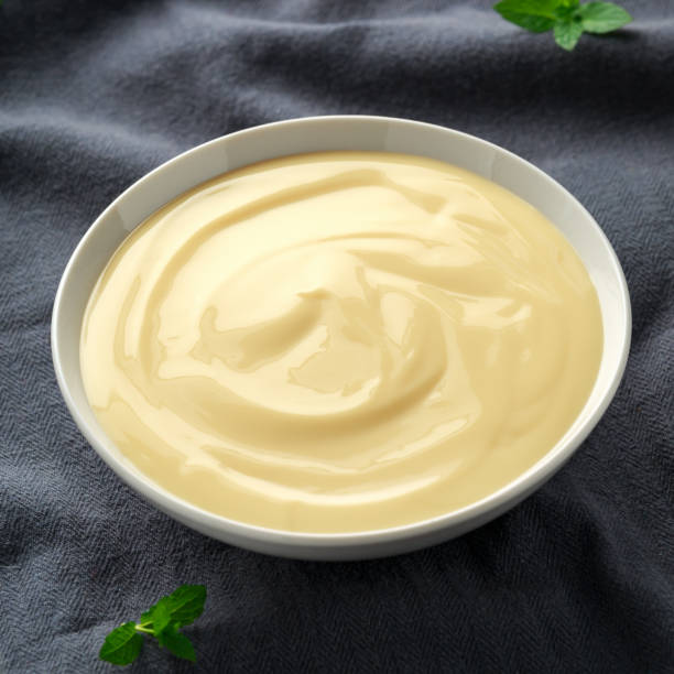 istock Bowl of vanilla custard on rustic background 1150078150