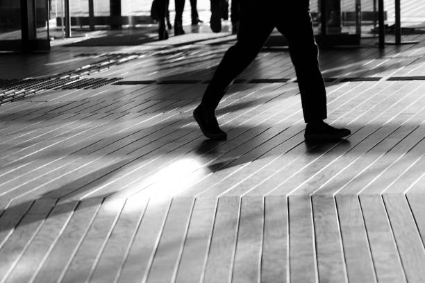 istock Shadow of people that walk the wood deck 1150078506