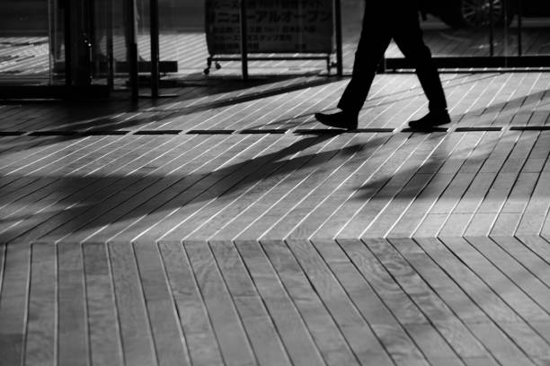 istock Shadow of people that walk the wood deck 1150079047
